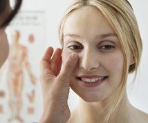 patient having her skin evaluated by a doctor