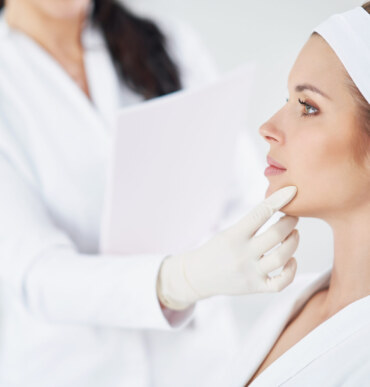 Doctor checking a patient's chin