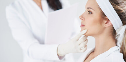 Doctor checking a patient's chin