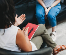 Psychotherapy session, woman talking to his psychologist in the studio