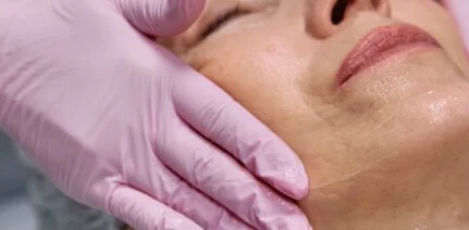 Old woman in a facial procedure